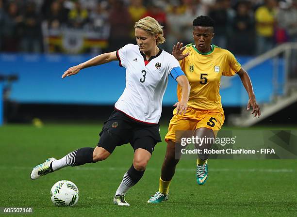 Saskia Bartusiak of Germany is chased by Msipa Emmaculate of Zimbabwe during the Women's First Round Group F match between Zimbabwe and Germany at...