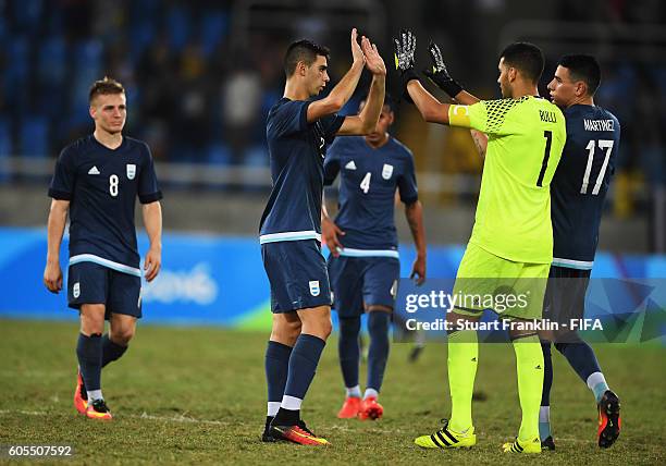 Players of Argentina celebrate at the end of the Olympic Men's Football match between Argentina and Algeria at Olympic Stadium on August 7, 2016 in...