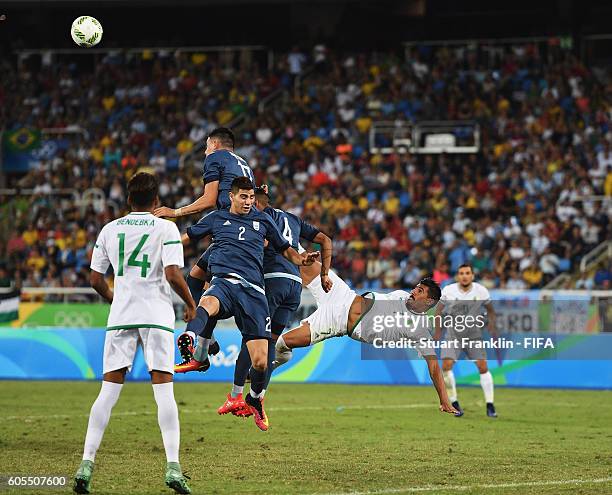 Baghdad Bounedjah of Algeria trys an overhead kick during the Olympic Men's Football match between Argentina and Algeria at Olympic Stadium on August...