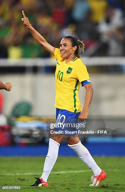 Marta of Brazil celebrates scoring her second goal during the Olympic Women's Football match between Brazil and Sweden at Olympic Stadium on August...
