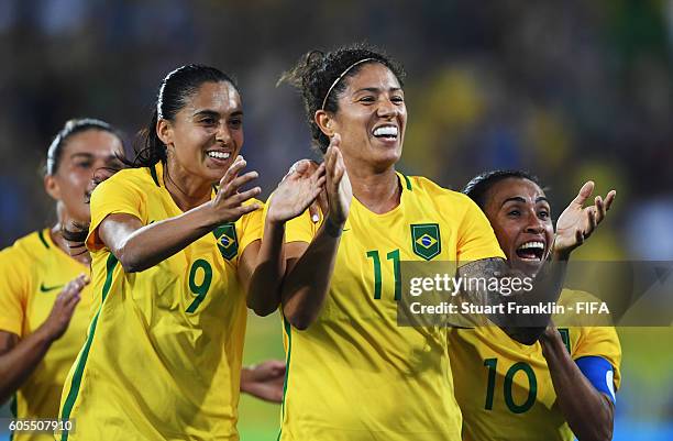 Cristiane of Brazil celebrates scoring her goal with Marta and Andressa Alves during the Olympic Women's Football match between Brazil and Sweden at...