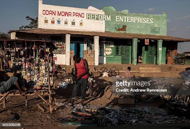 Men sell bicycle parts in the village of Jali, which lies in one of the areas most affected by drought, on September 10, 2016 in Zomba, Malawi....