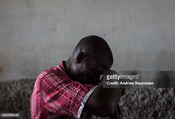 Man prays during Sunday service at Mofolo Woyera church in the village of Mulele, which lies in one of the areas most affected by drought, on...