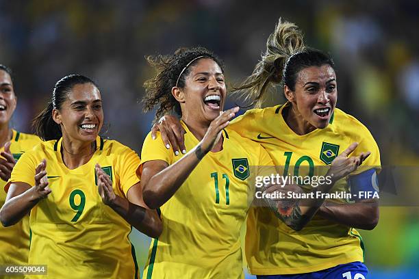 Cristiane of Brazil celebrates scoring her goal with Marta and Andressa Alves during the Olympic Women's Football match between Brazil and Sweden at...