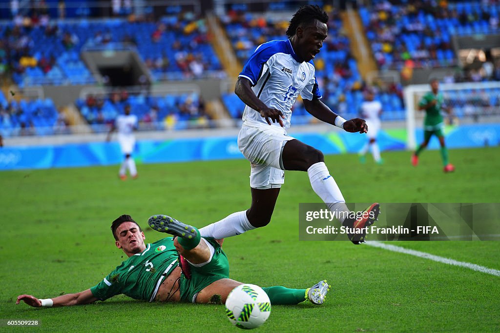 Alberth Elis Of Honduras Is Challenged By Ryad Keniche Of Algeria alberth-elis-of-honduras-is-challenged-by-ryad-keniche-of-algeria