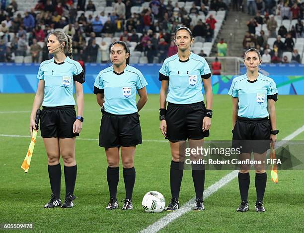 The match officials line up for the Women's Football Quarter Final match between Canada and France on Day 7 of the Rio 2016 Olympic Games at Arena...