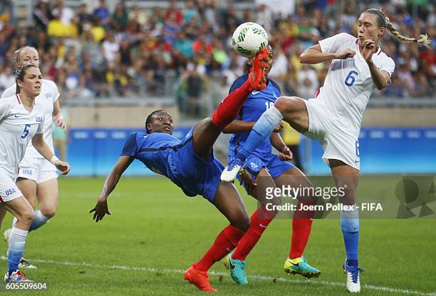 Whitney Engen of USA and Kadidiatou Diani of France compete for the ball during the Women's Group G match between USA and France on Day 1 of the...