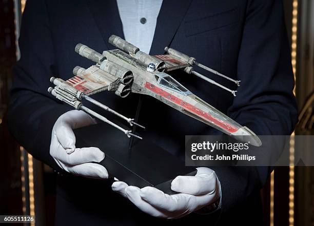 Model X-Wing fighter from The Empire Strikes Back estimated at £60k-£80k goes on display ahead of the Prop Store Rare Film and TV Memorabilia auction...