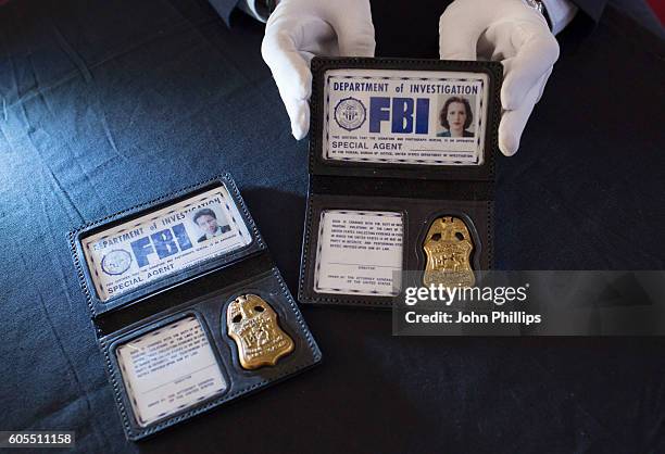 Scully & Mulder FBI Photo ID & Badge from The X-Files estimated at £3k-£5k each go on display ahead of the Prop Store Rare Film and TV Memorabilia...