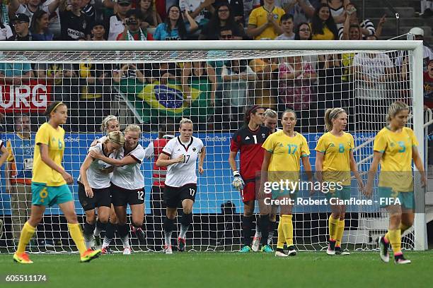 Saskia Bartusiak of Germany celebrates with team mates after scoring a goal during the Women's First Round Group F match between Germany and...