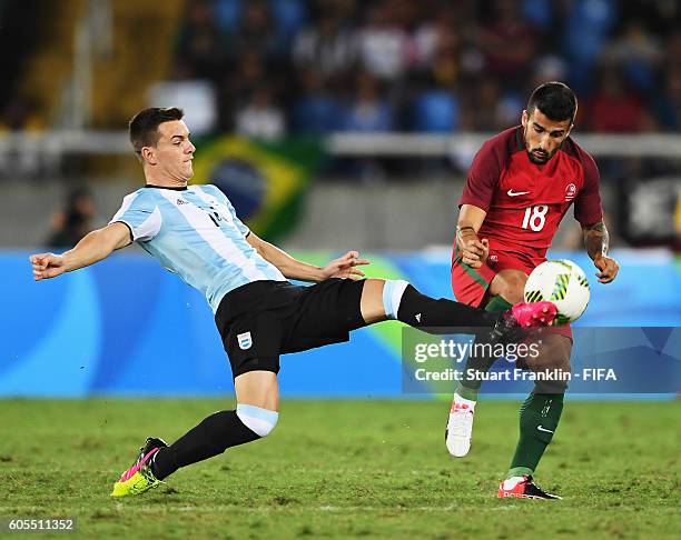 Tiago Silva of Portugal is challenged by GiovaniLo Celso of Argentina during the Olympic Men's Football match between Portugal and Argentina at...