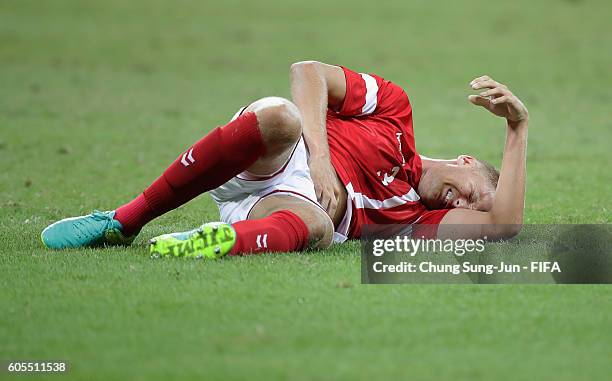 Kasper Larsen of Denmark is injured during the Men's Football Quarter Final match between Nigeria and Denmark on Day 8 of the Rio 2016 Olympic Games...