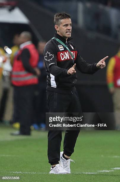 Canadian coach John Heardman gestures during the Women's Football Quarter Final match between Canada and France on Day 7 of the Rio 2016 Olympic...