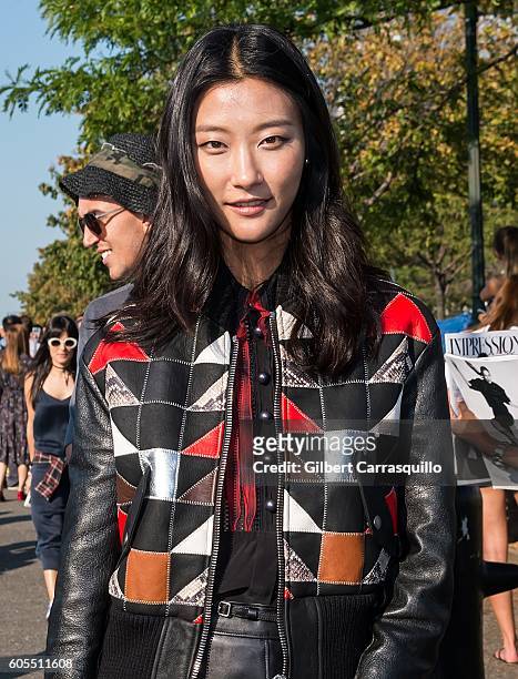 Fashion goer is seen arriving at Coach 1941 Women's Spring 2017 Show at Pier 76 on September 13, 2016 in New York City.