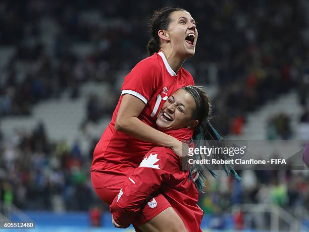 Christine Sinclair and Sabrina D'Angelo of Canada celebrate after canada defeated France during the Women's Football Quarter Final match between...