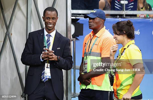 Staff worRafael Tinoco, a general coordinator of FIFA works on the pitch before the Women's Football match between New Zealand and France on Day 4 of...