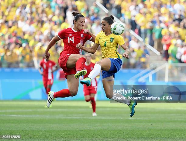 Melissa Tancredi of Canada and Rafaelle of Brazil compete for the ball during the Women's Football Bronze Medal match between Brazil and Canada on...