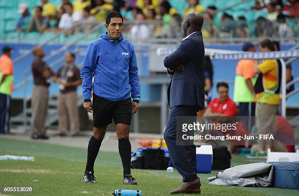 4th official Diego Haro talks with Nigeria head coach during the Men's Football Quarter Final match between Nigeria and Denmark on Day 8 of the Rio...