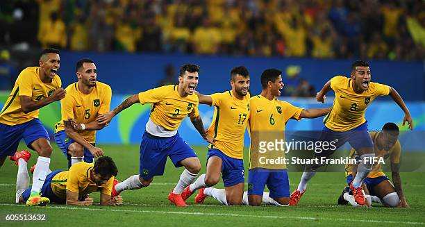 The players of Brazil celebrate winning the penalty shoot out at the Olympic Men's Final Football match between Brazil and Germany at Maracana...