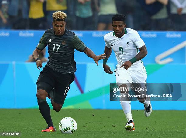 Imoh Ezekiel of Nigeria is chased by Serge Gnabry of Germany during the Men's Football Semi Final between Nigeria and Germany on Day 12 of the Rio...