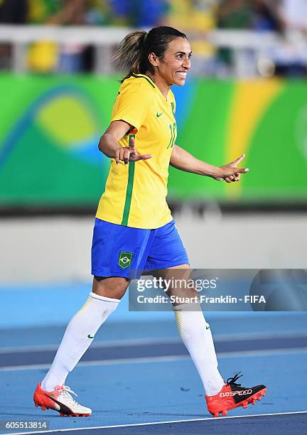 Marta of Brazil celebrates after the Olympic Women's Football match between Brazil and Sweden at Olympic Stadium on August 6, 2016 in Rio de Janeiro,...