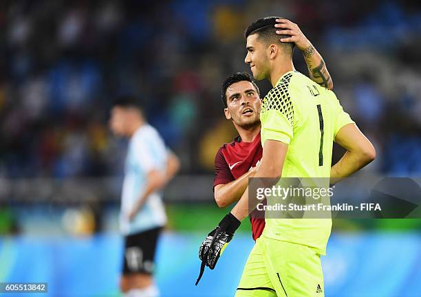 Salvador of Portugal consoles Geronimo Rulli of Argentina during the Olympic Men's Football match between Portugal and Argentina at Olympic Stadium...