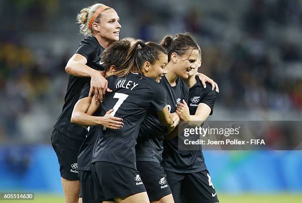 Amber Hearn of New Zealand celebrates with her team mates after scoring her team's first goal during the Women's Group G match between Colombia and...