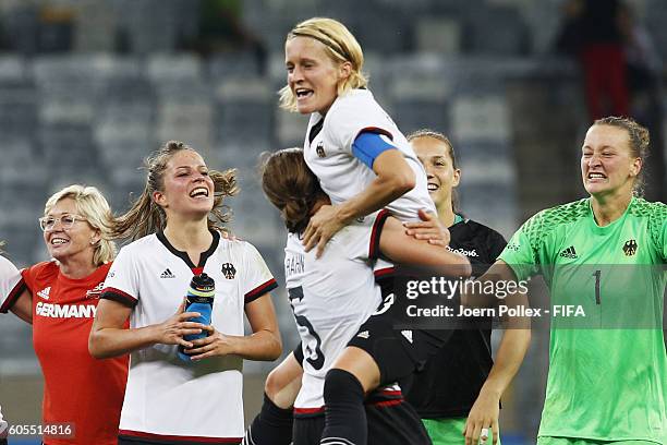 The team of Germany celebrates after winning the Women's Semi Final match between Canada and Germany on Day 11 of the Rio2016 Olympic Games at...