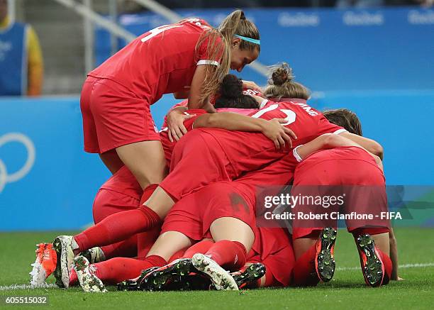 Sophie Schmidt of Canada celebrates after scoring a goal during the Women's Football Quarter Final match between Canada and France on Day 7 of the...