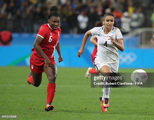 Deanne Rose of Canada and Sakina Karchaoui of France chase the ball during the Women's Football Quarter Final match between Canada and France on Day...