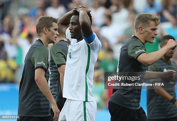 John Obo Mikel of Nigeria reacts after missing a shot on goal during the Men's Football Semi Final between Nigeria and Germany on Day 12 of the Rio...