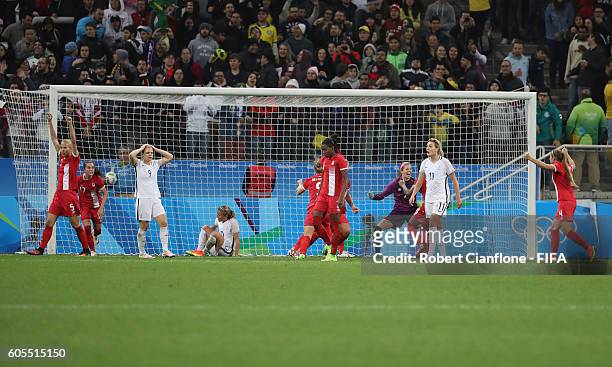 Canada celebrate after they defeated France during the Women's Football Quarter Final match between Canada and France on Day 7 of the Rio 2016...