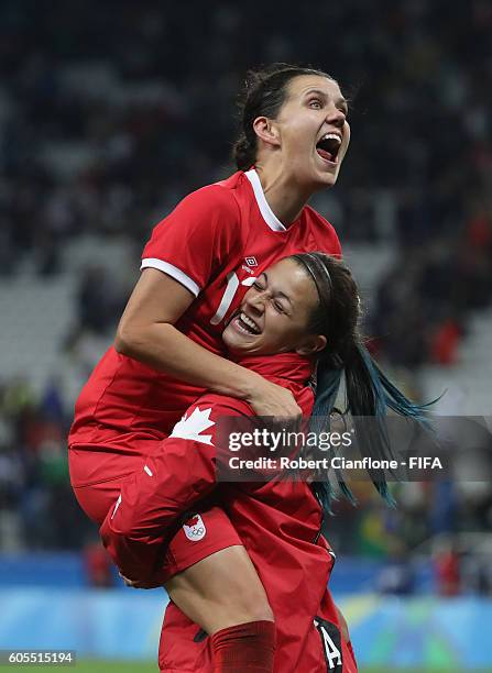 Christine Sinclair and Sabrina D'Angelo of Canada celebrate after canada defeated France during the Women's Football Quarter Final match between...