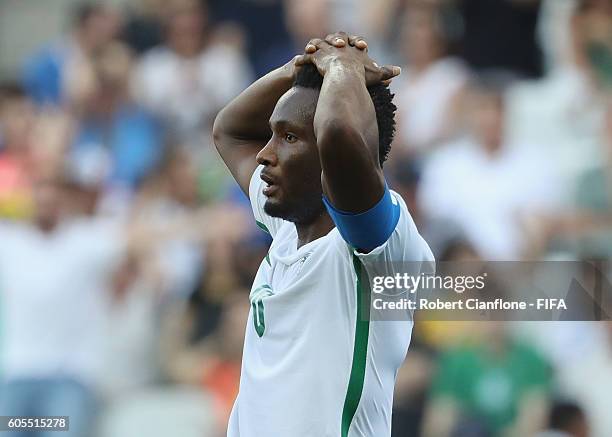 John Obo Mikel of Nigeria reacts after missing a shot on goal during the Men's Football Semi Final between Nigeria and Germany on Day 12 of the Rio...
