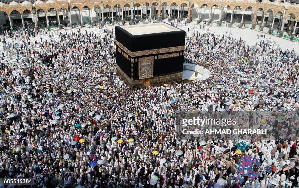 Muslim pilgrims from all around the world circle around the Kaaba at the Grand Mosque, in the Saudi city of Mecca on September 14, 2016. More than...