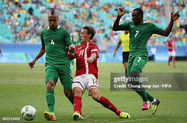 Casper Nielsen of Denmark competes for the ball with William Ekong of Nigeria during the Men's Football Quarter Final match between Nigeria and...