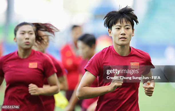 China warm up before the Women's Football Quarter Final match between China and Germany on Day 7 of the Rio 2016 Olympic Games at Arena Fonte Nova on...