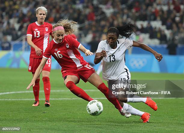 Janine Beckie of Canada challneges Diani Kadidiatou of France during the Women's Football Quarter Final match between Canada and France on Day 7 of...