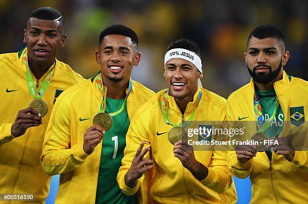 Neymar of Brazil celebrates with his medal and teamates at the Olympic Men's Final Football match between Brazil and Germany at Maracana Stadium on...