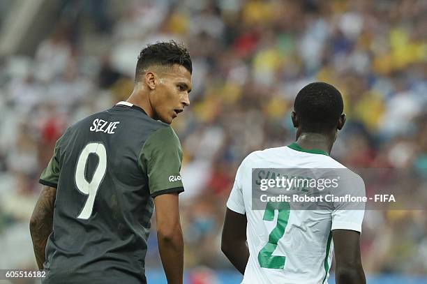 Davie Selke of Germany speaks to Muenfuh Sincere of Nigeria during the Men's Football Semi Final between Nigeria and Germany on Day 12 of the Rio...
