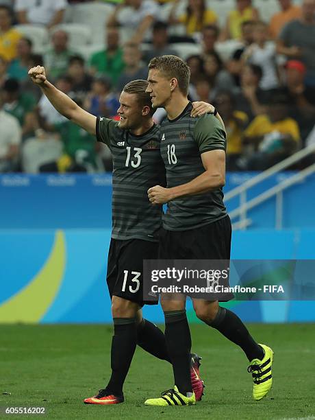 Nils Petersen of Germany celebrates with Philipp Max after scoring a goal during the Men's Football Semi Final between Nigeria and Germany on Day 12...