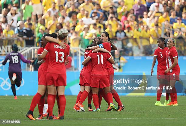 Canada celebrate after they defeated Brazil during the Women's Football Bronze Medal match between Brazil and Canada on Day 14 of the Rio 2016...