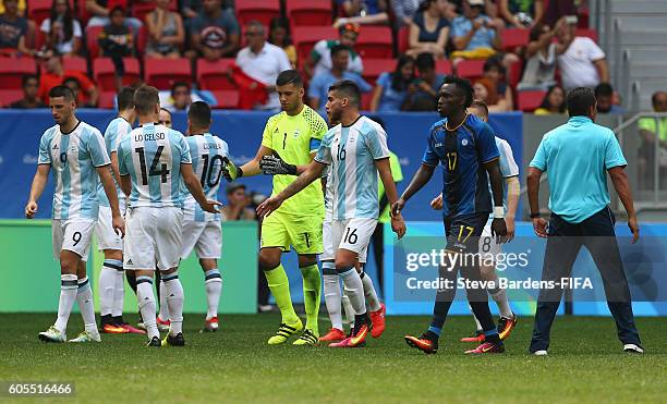 The Argentina players celebrate after Honduras miss a penalty during the Men's First Round Group D match between Argentina and Honduras on Day 5 of...