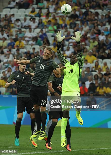 Nigerian goalkeeper Emmanuel Daniel takes the ball during the Men's Football Semi Final between Nigeria and Germany on Day 12 of the Rio 2016 Olympic...