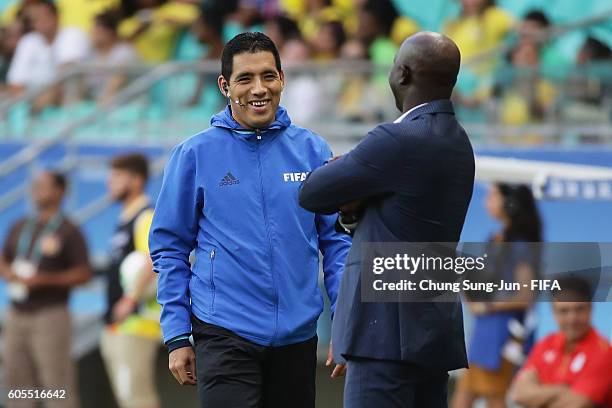 4th official Diego Haro talks with Nigeria head coach during the Men's Football Quarter Final match between Nigeria and Denmark on Day 8 of the Rio...