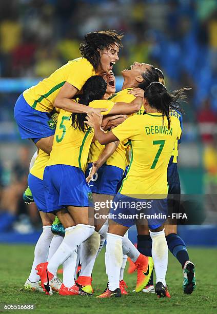 Beatriz of Brazil celebrates scoring her second goal during the Olympic Women's Football match between Brazil and Sweden at Olympic Stadium on August...