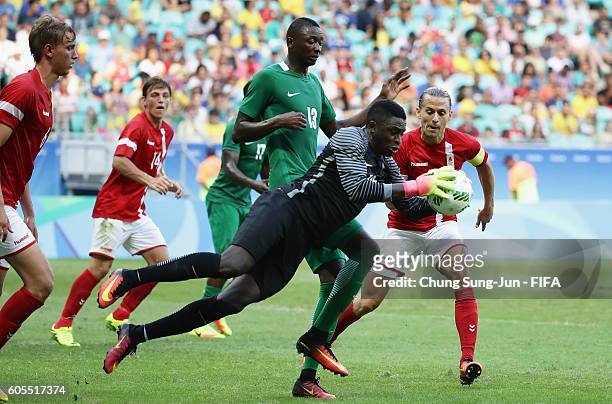 Goalkeeper Emmanuel Daniel of Nigeria catchs the ball during the Men's Football Quarter Final match between Nigeria and Denmark on Day 8 of the Rio...