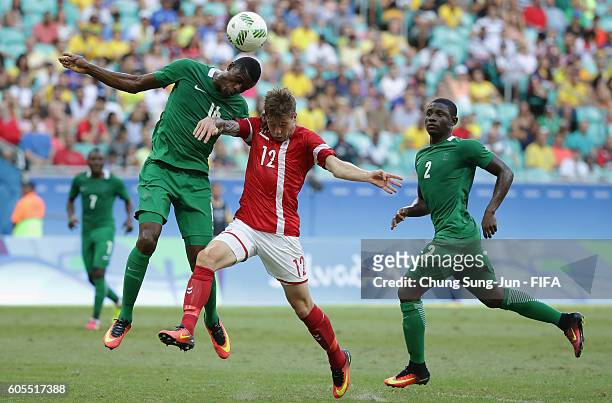 Frederik Borsting of Denmark competes for the ball with Stanley Amuzie of Nigeria during the Men's Football Quarter Final match between Nigeria and...
