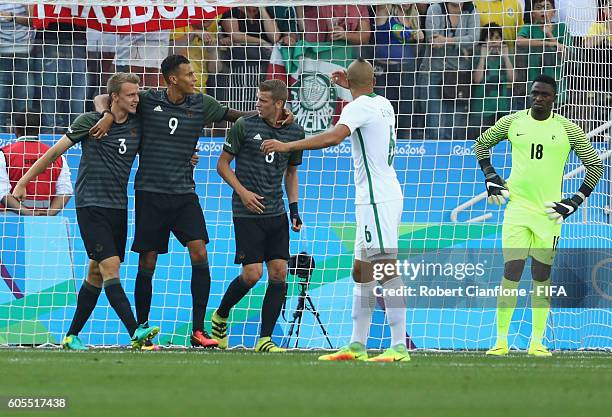Lukas Klostermann of Germany celebrates with team mates after scoring a goal during the Men's Football Semi Final between Nigeria and Germany on Day...