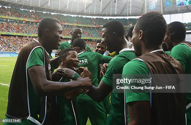 Nigeria players celebrate after their second goal during the Men's Football Quarter Final match between Nigeria and Denmark on Day 8 of the Rio 2016...